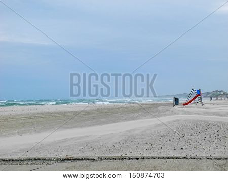 deserted beach and windy rough sea in lokken