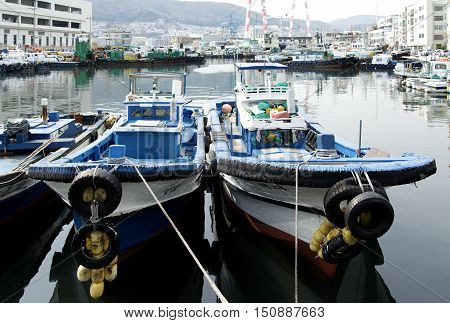 Busan South Korea - March 23th 2016: Busan Fishing boats in one of bays of port Busan