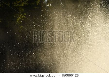 Water drops in the air back-lit backdrop bright