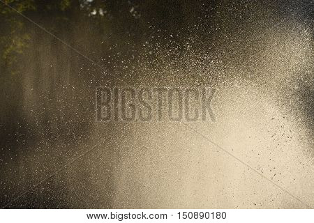 Water drops in the air back-lit backdrop bright