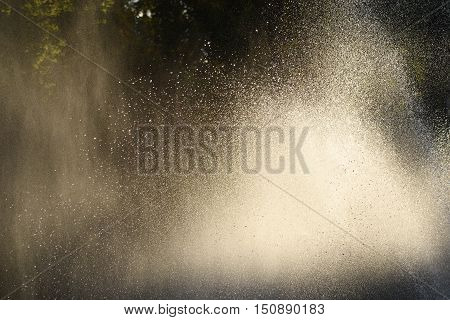 Water drops in the air back-lit backdrop bright