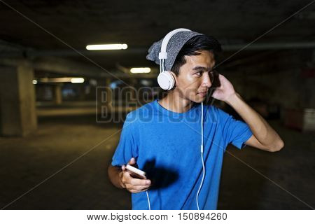 Teenager Style Listening Music Headphone Street Concept