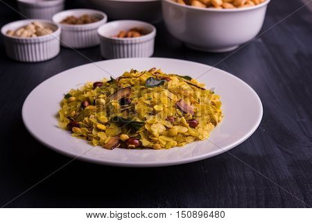 homemade tasty Diwali food or Diwali snacks or Diwali sweets like rava laddu, chakli, sev, shankar pale and chivda or chiwada with dry fruits in white bowls, favourite indian diwali recipe