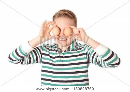Young Boy Play The Eggs Over The White