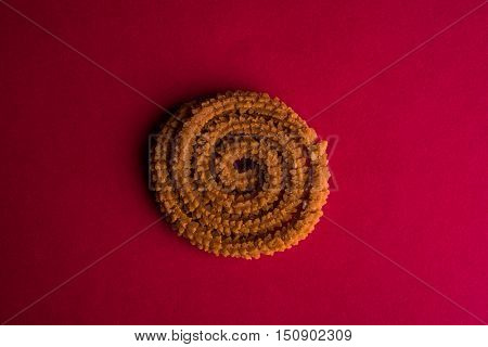 tasty Indian Snack Chakli, one chakali, isolated