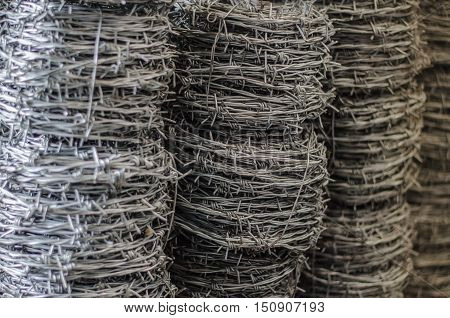 barbed wire roll  iron, isolation, jail close up