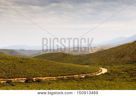 The Farm Road Leading To The Mountains