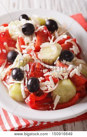 Bulgarian Cuisine: Shopska Vegetables Salad With Feta Closeup On A Plate. Vertical