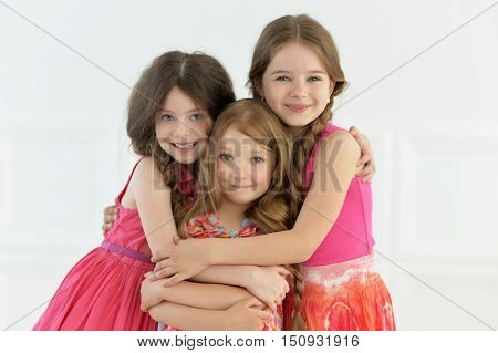 portrait of cute little girls posing in studio