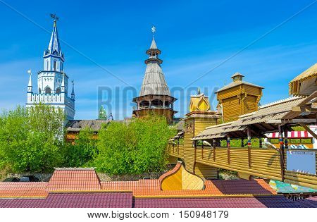 The red roofs of souvenir market in Izmailovo also famous as Vernissage and the towers of Izmailovsky Kremlin the cultural center of arts and crafts Moscow Russia.