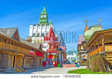 The unique entertainment complex of Izmailovsky Kremlin contains examples of traditional Russian architecture - the timbered St Nicholas Church Tsar's Palace colorful mansions and towers Moscow Russia.