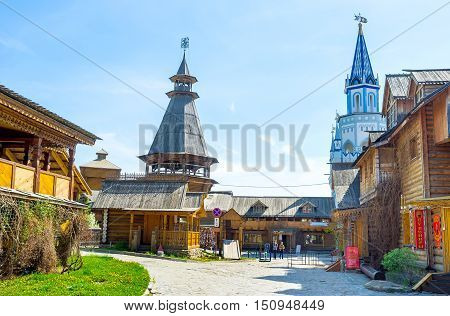 MOSCOW RUSSIA - MAY 10 2015: The Izmailovsky Kremlin contains a lot of museums craft centers and cafes partly located in traditional timbered buildings named izba on May 10 in Moscow.