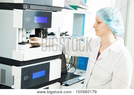 Female researcher analyzing liquid chromatography data