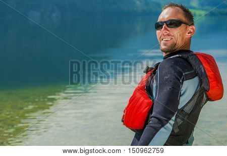 Happy Water Sportsman in Wetsuit. Summer Time Water Fun.