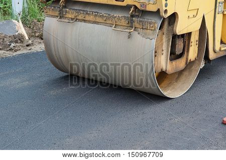 Road paving / Road roller compacting asphalt