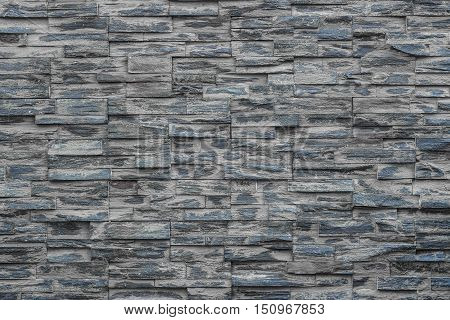 Layer of stone plate arranged as a wall / Stone wall background