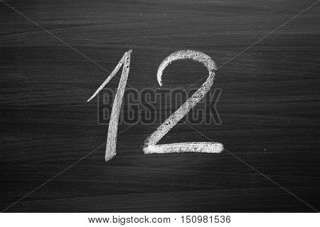 number twelve enumeration written with a chalk on the blackboard