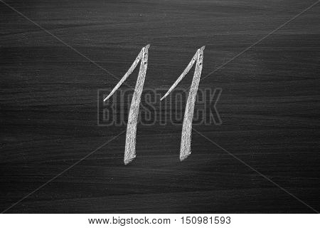 number eleven enumeration written with a chalk on the blackboard