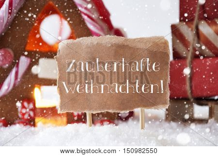 Gingerbread House In Snowy Scenery As Christmas Decoration. Sleigh With Christmas Gifts Or Presents And Snowflakes. Label With German Text Zauberhafte Weihnachten Means Magic Christmas