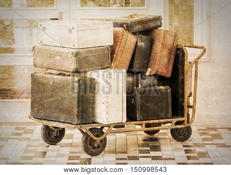 Trolley full of old luggage vintage setting