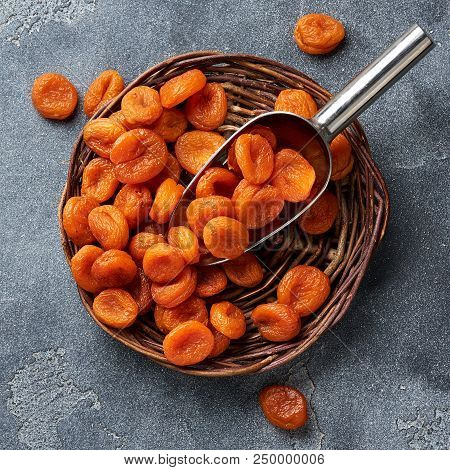 Dried Apricots On Gray Background. Top View.