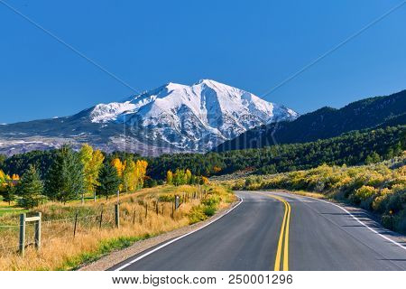 Highway in Colorado at autumn, USA. Mount Sopris landscape.