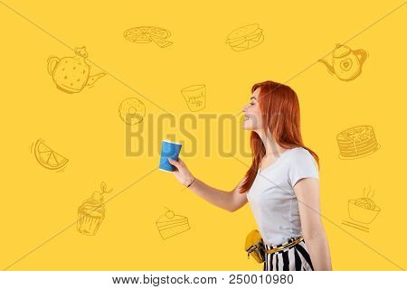 Tea Please. Cute Young Person Smiling And Looking Friendly While Ordering Tasty Tea In A Local Cafe