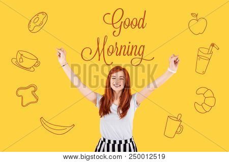 Happy Morning. Cheerful Enthusiastic Designer Feeling Happy And Putting Her Hands Up While Greeting 