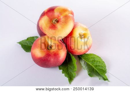 New Hybrid Sweet Fruit Nectarina Platerina, Flat Saturn Or Donut Nectarine Peaches Close Up