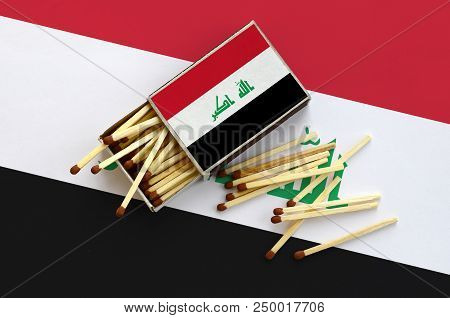 Iraq Flag  Is Shown On An Open Matchbox, From Which Several Matches Fall And Lies On A Large Flag.