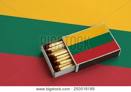 Lithuania Flag  Is Shown In An Open Matchbox, Which Is Filled With Matches And Lies On A Large Flag.