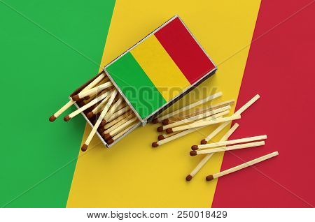 Mali Flag  Is Shown On An Open Matchbox, From Which Several Matches Fall And Lies On A Large Flag.