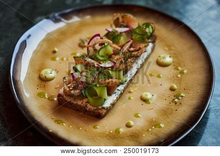 Smorrebrod Danish Sandwich With Salmon Fish, Curd Mousse, Marinated Cucumber And Radish. Delicious V