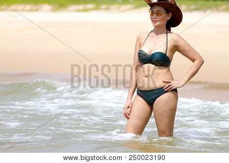 Woman Show Body Sex Symbol With Bikini Hat And Wave On Beach At Bang Beot Beach, Chumphon Province T