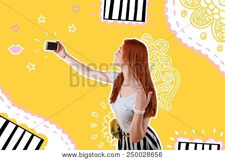 Beauty. Popular Beautiful Actress Touching Her Long Hair And Taking A Selfie With A Help Of Her Mode