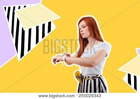 Using Smart Watch. Calm Beautiful Student Touching The Screen Of A Modern Smart Watch And Using It F
