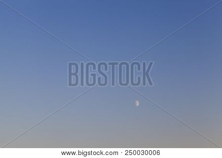 Half A White Moon In The Blue Sky At Dusk, Landscape