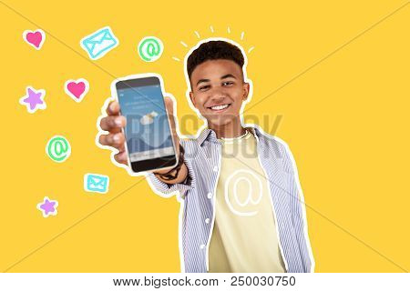 New Smartphone. Positive Young Person Smiling And Feeling Happy While Demonstrating His New Amazing 