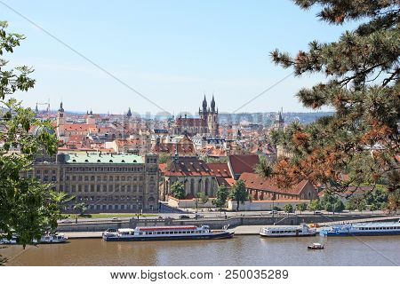 The Old City Of Prague Czech Republic With Vltava River, Ships And A Blue Summer Sky