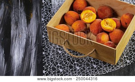 Peaches In A Wooden Box. Dark Background. Fresh Peach Concept. Flat Lay. Copy Text.
