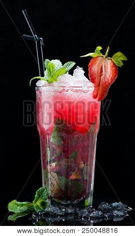 Cocktail Strawberry Mojito On A Dark Background Close-up On The Bar