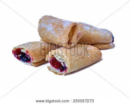 Cookies Rolled With Cherries And Black Currants Isolated On A White Background. Sweet Dessert.