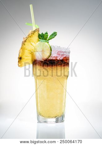 Tropical Maitai Cocktail With Pineapple Slice On A Light Background