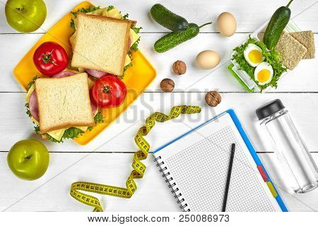 Top View Planning Notebook With Copy Space And Healthy Breakfast. Sandwich With Ham And Cheese, Eggs