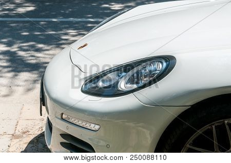 Novi Sad, Serbia. July - 15. 2018. Headlight And Front Part Of The Hood Of The White Porsche Panamer