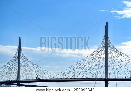 The Big And Modern Cable-stayed Bridge In St. Petersburg Against The Background Of The Cloudy Sky