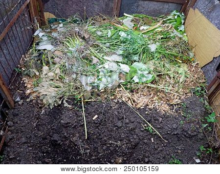 Composting In The Garden. A Place For Processing Waste And Creating Fertilizer. Siberian Garden