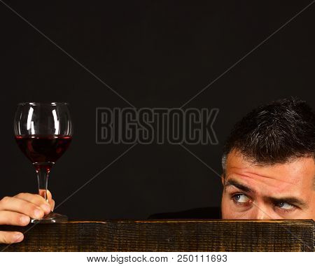 Degustator With Hidden Face Behind Wooden Chair. Sommelier Tastes Expensive Drink. Winetasting And D