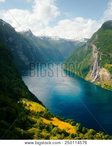 Breathtaking view of Sunnylvsfjorden fjord and famous Seven Sisters waterfalls, near Geiranger village in western Norway.