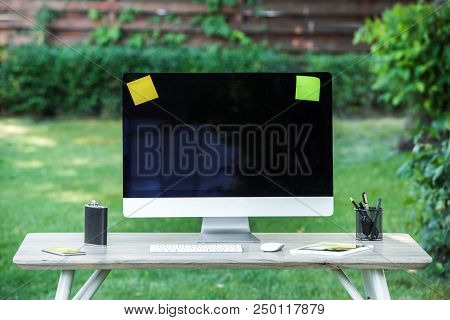 Selective Focus Of Flask, Digital Tablet, Computer With Blank Screen, Stick It Notes And Smartphone 